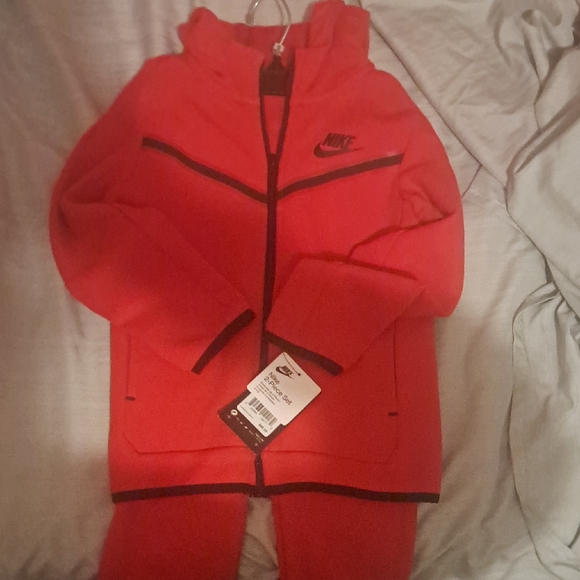 red nike hoodie and pants